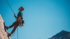 A man is climbing a rock